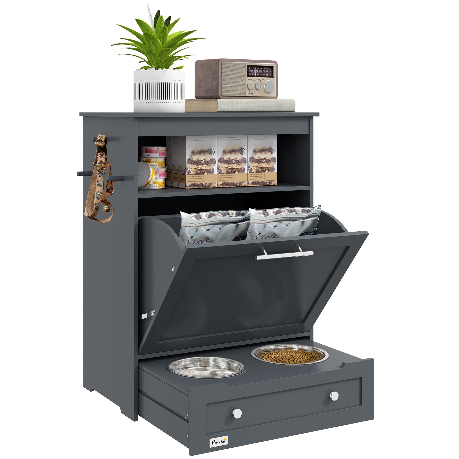 dark grey pet feeder station, open compartment with food bags, stainless steel bowls, shelf with treats, potted plant on top